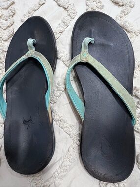 OluKai Black Footbed Flip Flops with Mint Green Straps